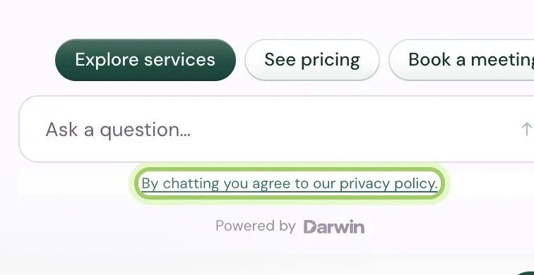The chat's message box, Ask a question, with the consent line By chatting you agree to our privacy policy under it, highlighted, above Powered by Darwin.