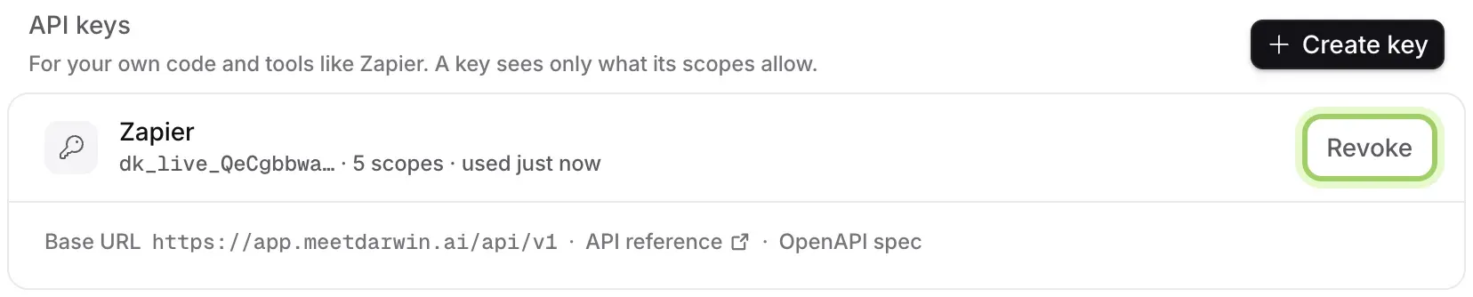 The API keys section with the Zapier key, 5 scopes, used just now, and the Revoke button highlighted. Under it, the Base URL and links to the API reference and OpenAPI spec.